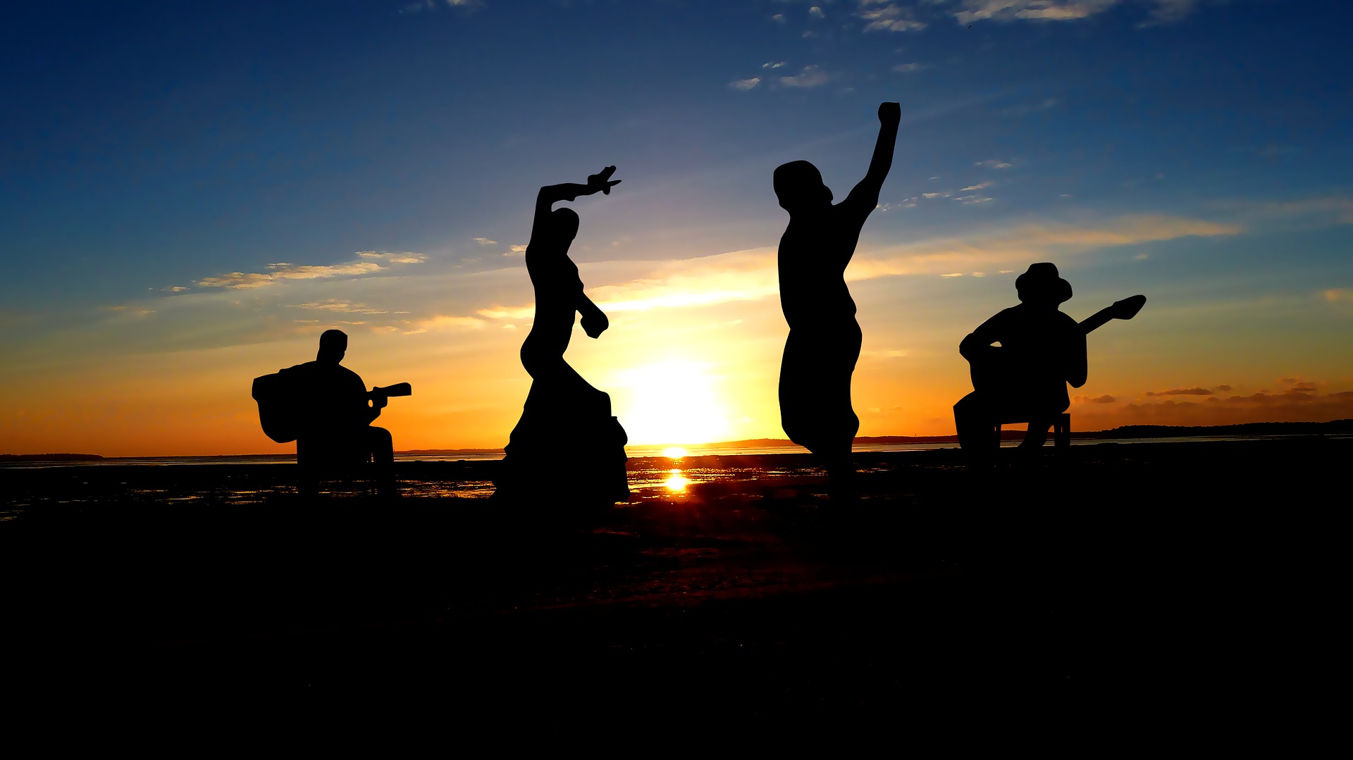 Imagen con gente bailando flamenco y tocando la guitarra